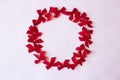 Red bow wreath patter on white paper. Christmas mood flat lay. Happy New Year flat lay on the paper