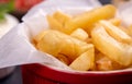 Red bowl of french fries chips potato and sauces on black background. fast food. close up Royalty Free Stock Photo