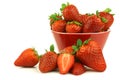 Red bowl full of fresh strawberries and a cut one Royalty Free Stock Photo