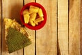 Red bowl with jackfruit pods and jackfruit skin, top view