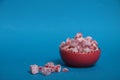 Red bowl of rahat lakoum  on blue background. Turkish sweet concept Royalty Free Stock Photo