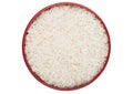 Red bowl of raw organic basmati rice on white background. Healthy food. Top view Royalty Free Stock Photo