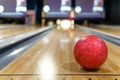 Red bowling ball and blur background in bowling playground