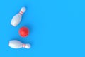 Red bowling ball and white pins on blue background Royalty Free Stock Photo