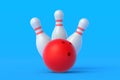 Red bowling ball and white pins on blue background Royalty Free Stock Photo