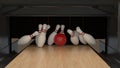 Red bowling strike ball on a wooden track with pins Royalty Free Stock Photo