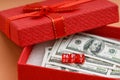 In a red box for gifts, money and cubes with the inscription NFT Royalty Free Stock Photo