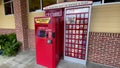 A red box movie rental machine with current DVD releases