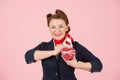 A Red box with ribbon in hand of brunette woman. Box for present in hand of beautiful airhostess. Valentine concept female