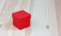 Red box on wooden table, selective focus. gift