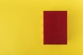 Red box on yellow background top view. Red rectangle on yellow background. Copy space. Mock up