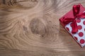 Red boxed birthday present on wooden board copy space holidays c Royalty Free Stock Photo
