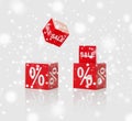 Red boxes with sale and percent sign over snow Royalty Free Stock Photo