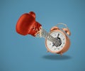 Red boxing glove coming out of alarm clock Royalty Free Stock Photo