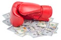 Red boxing glove on top of dollars bills isolated Royalty Free Stock Photo