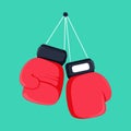 Red boxing gloves hanging on nail of wall, flat design icon Royalty Free Stock Photo