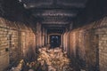 Red brick abandoned underground sewer tunnel with dramatic mysterious atmosphere, inside sewerage Royalty Free Stock Photo