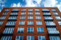 Red brick apartment building with white sky background, high angle view, Royalty Free Stock Photo