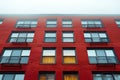 Red brick apartment building with white sky background, high angle view, Royalty Free Stock Photo