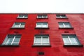 Red brick apartment building with white sky background, high angle view, Royalty Free Stock Photo