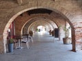 Red brick arches of a ground floor to Lisle sur Tarn in France.