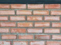 Red brick block wall show Pattern stack block rough surface texture material background Weld the joints with cement grout red