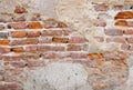 Red brick block wall texture old background ancient weathered brick wall with cracks and destroyed stucco layer . Royalty Free Stock Photo