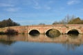 Red brick bridge over river Royalty Free Stock Photo