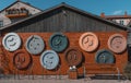 Red brick building with large buttons on it. Bicycle parking spots and a bench in front of it Royalty Free Stock Photo