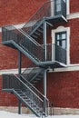 Red brick building. Staircase, the facade of the building. fire exit. Royalty Free Stock Photo