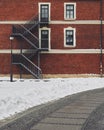 Red brick building. Staircase, the facade of the building. fire exit Royalty Free Stock Photo