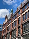 Red brick building with a tower on it and architecture details Royalty Free Stock Photo