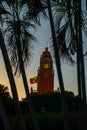 Red brick building tower with golden dome and clock in the City center of Merida. Mexican flag flutters on air. City Town hall of Royalty Free Stock Photo