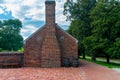 Red brick chimney in brick wall Royalty Free Stock Photo