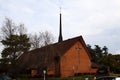 Red Brick Christian Church Against Cloudy Sky Royalty Free Stock Photo