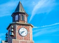 Red brick clock tower with bells Royalty Free Stock Photo