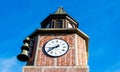 Red brick clock tower with bells Royalty Free Stock Photo