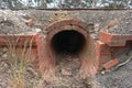Red brick culvert drain under railroad tracks Royalty Free Stock Photo