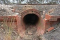 Red brick culvert drain under railroad tracks
