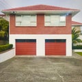 Red brick double storey house.