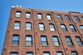 The red brick facade of One Tiffany Pl showing, star bolts, in Brooklyn, NYC Royalty Free Stock Photo