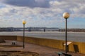 A red brick footpath through Mud Island Park near the vast waters of the Mississippi river and a bridge over the water Royalty Free Stock Photo