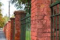 Red , brick gate pylons in row close up shot Royalty Free Stock Photo