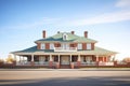 red brick georgian mansion with a hip roof and white columns Royalty Free Stock Photo