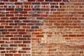 Red brick grunge background with an area that used to be an opening filled in with different bricks