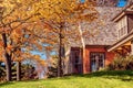 House with Fall Colored Foliage Royalty Free Stock Photo