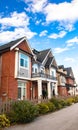 Red brick homes side by side. Row of Typical English Terraced Houses, townhomes. Royalty Free Stock Photo