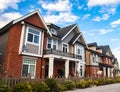 Red brick homes side by side. Row of Typical English Terraced Houses, townhomes.