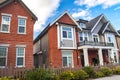 Red brick homes side by side. Row of Typical English Terraced Houses, townhomes.