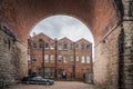 Red brick homes under old historic railway bridge arches viaduct Royalty Free Stock Photo